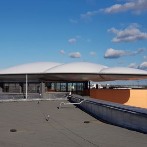 Inflatable canopies that protect customers from the rain